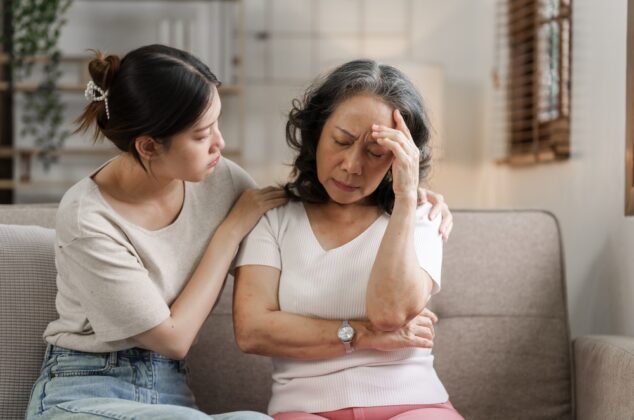 Young woman comforting an older woman and showing sympathy